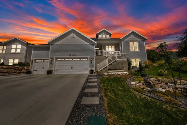 Contemporary exterior with light blue siding and white trim