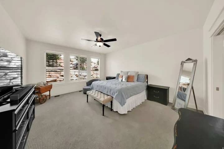 Triple window installation, ceiling fan fixture, and carpeting