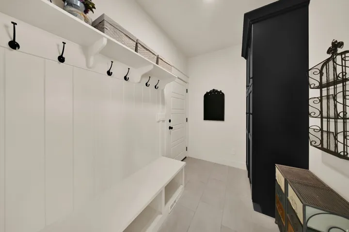 Built-in bench with integrated storage and wall-mounted shelving