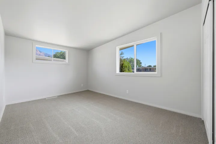 Carpeted bedroom  #1 and two windows