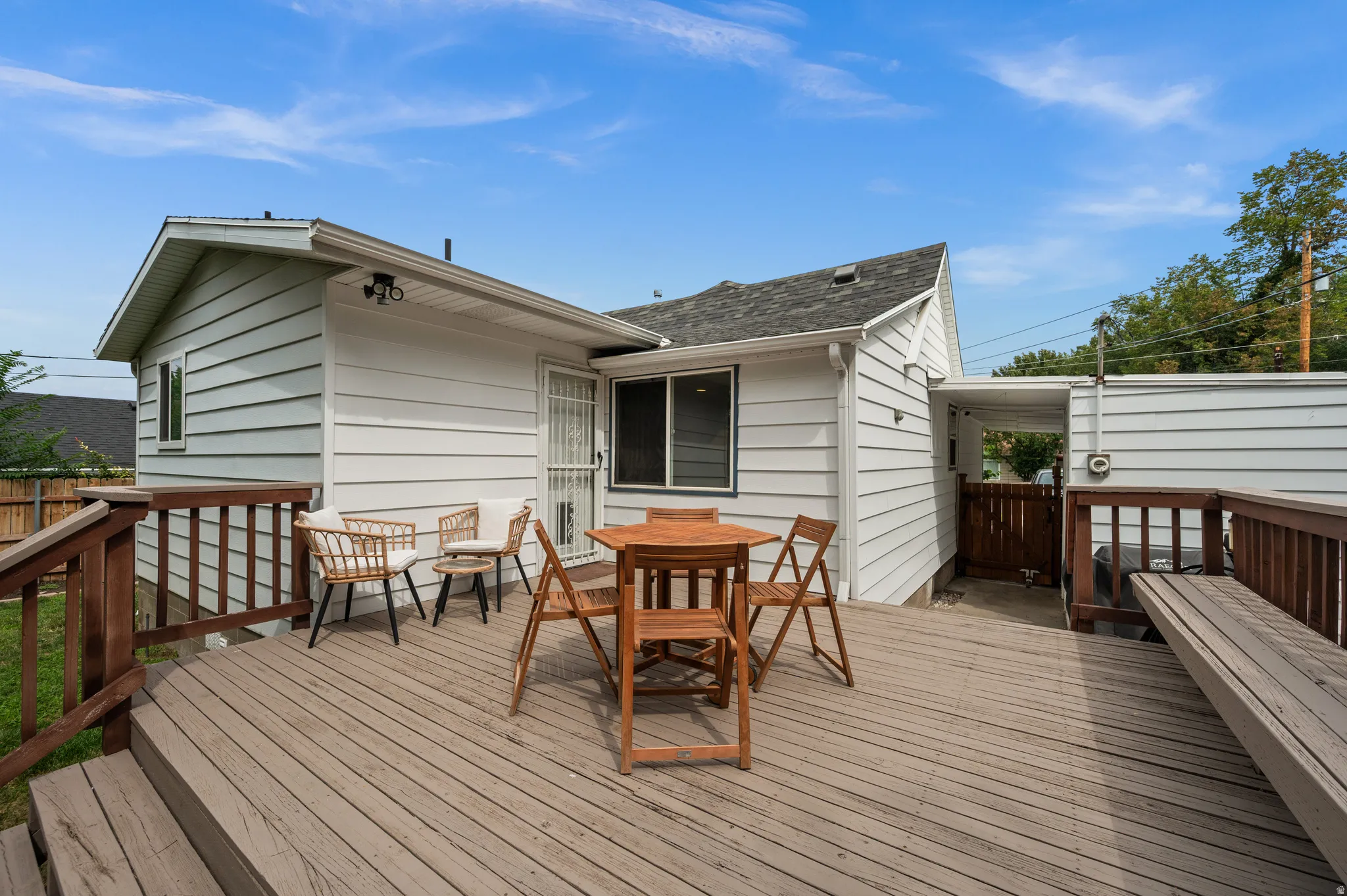 Expansive wood deck with railing and integrated seating