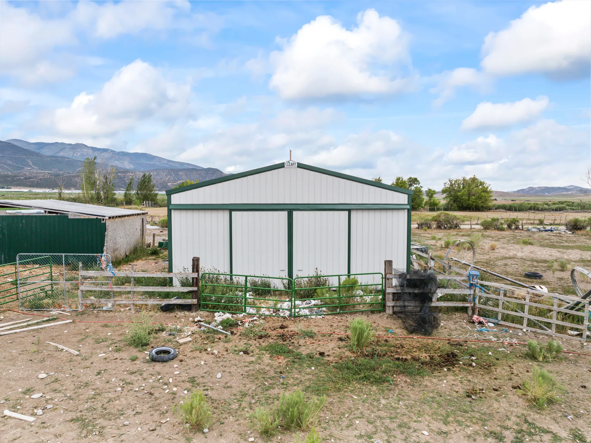 Steel frame building with a pitched roof and sliding doors