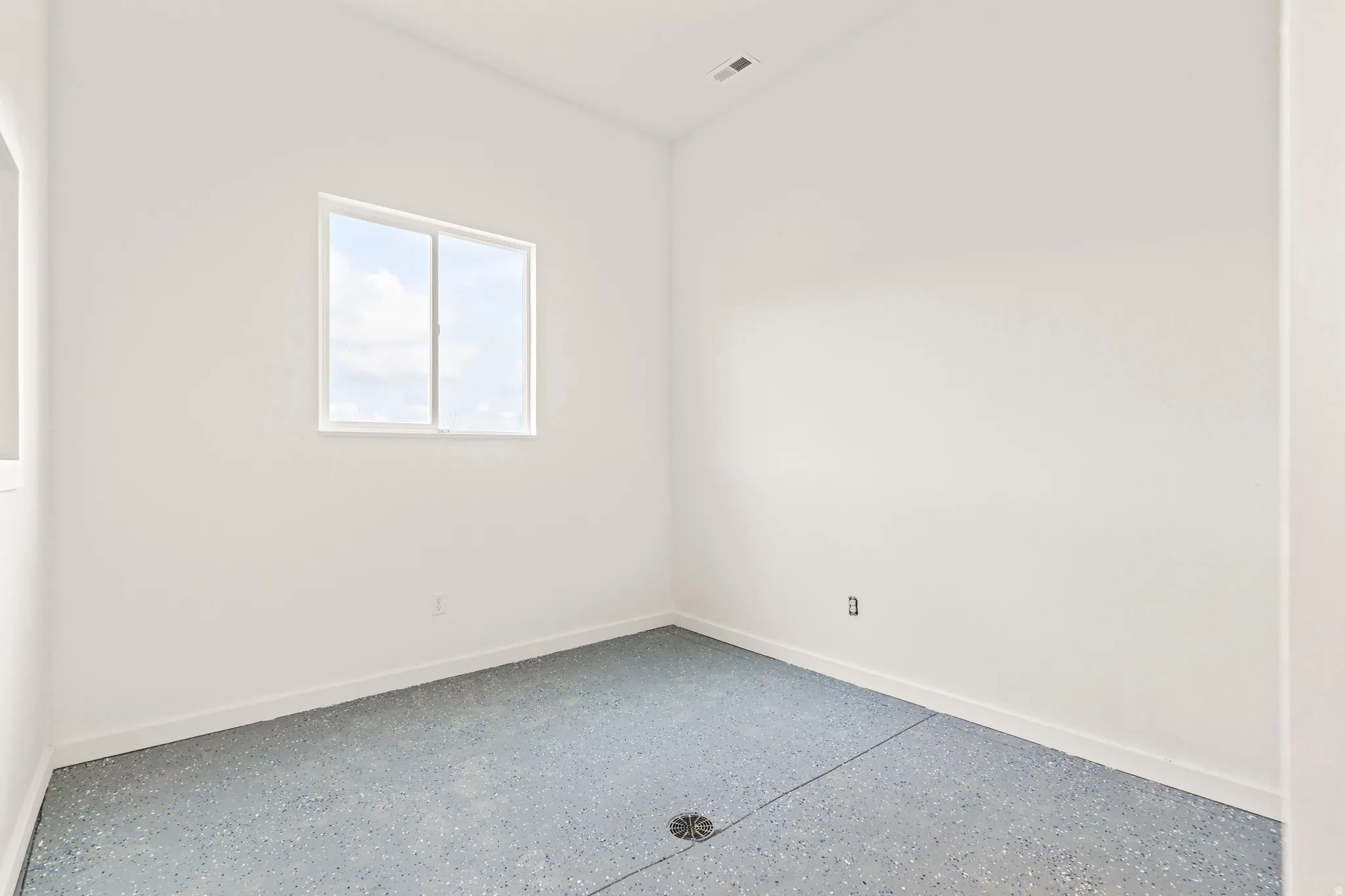 White walls with a light-colored window frame