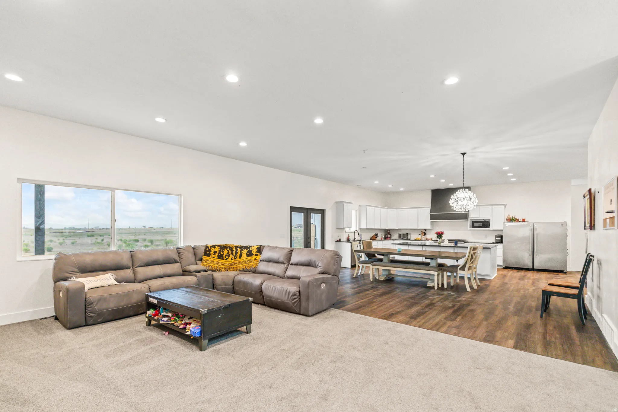 Expansive open-concept living area with recessed lighting