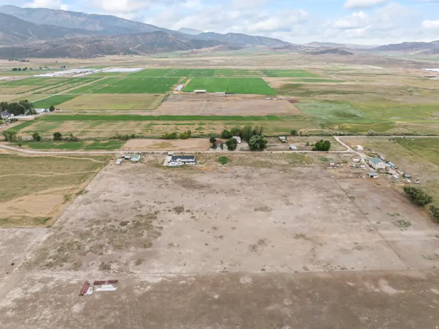 Expansive agricultural land with a rural setting and distant mountains
