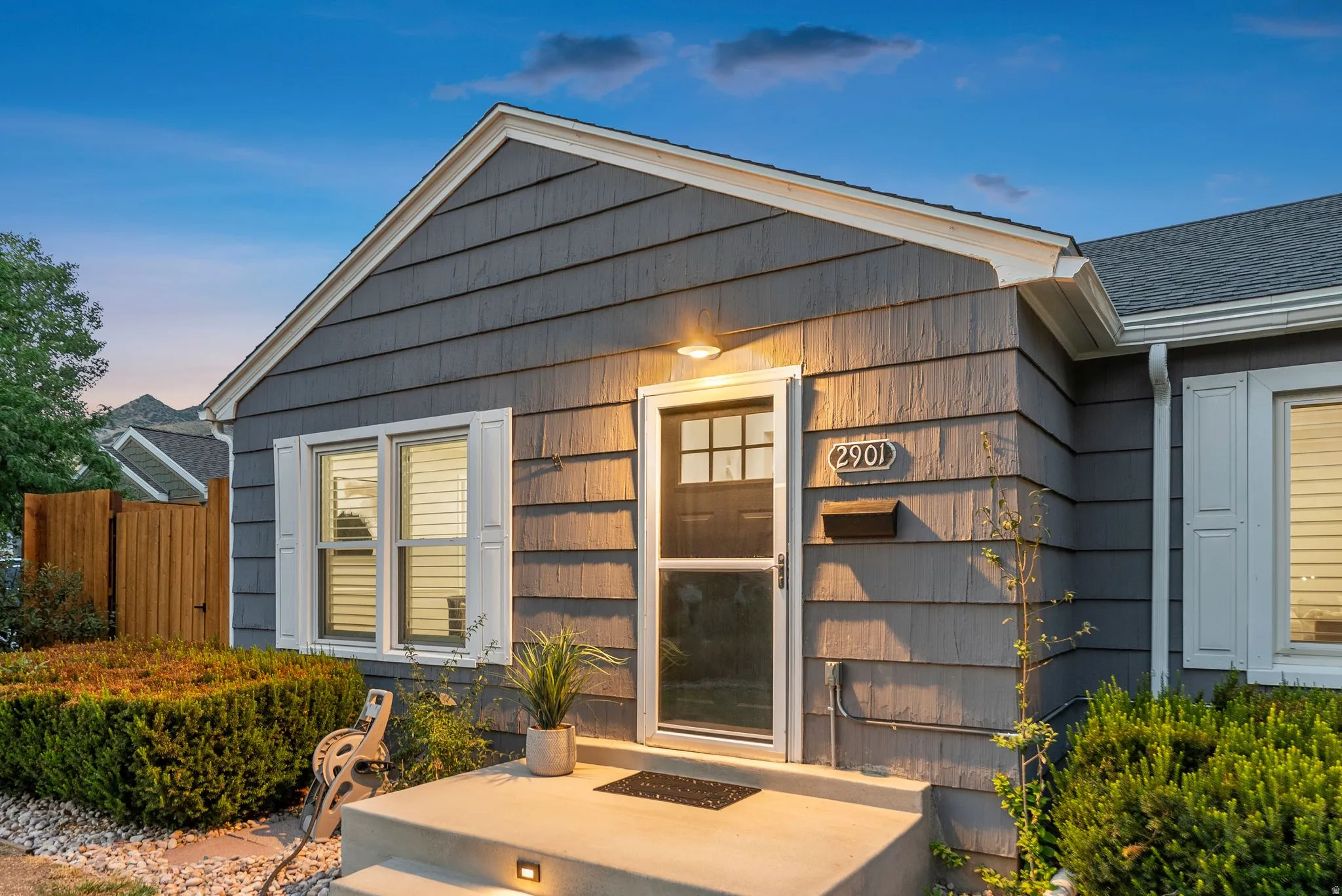 Gable roofline with shingle siding and white trim