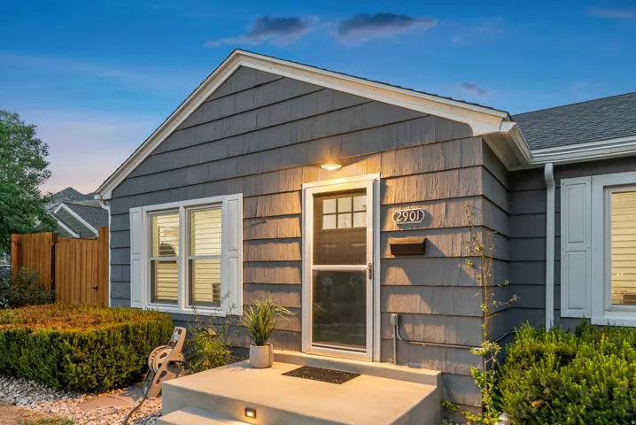 Gable roofline with shingle siding and white trim