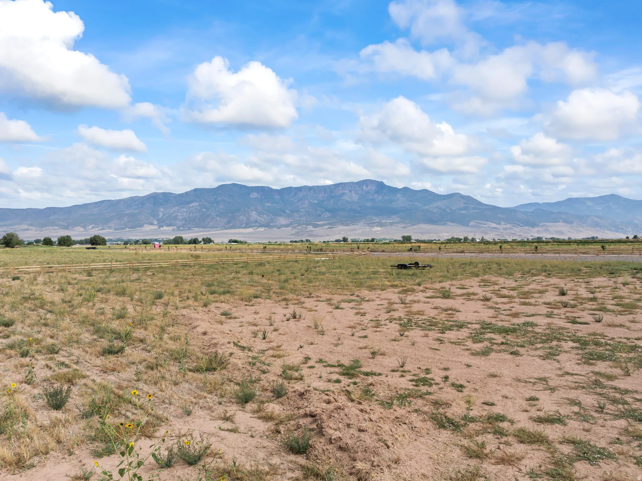 Expansive land parcel featuring distant mountain range and open skies
