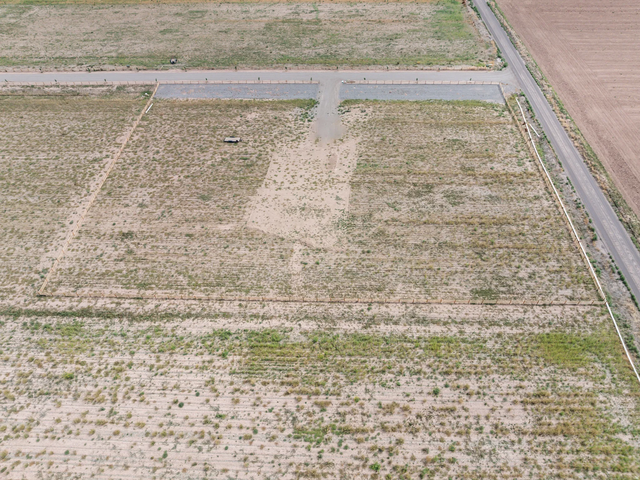 Expansive lot featuring undeveloped land, established gravel road access, and clear boundary lines
