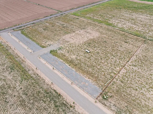 Gracel-surfaced private roads, fenced property lines, and expansive undeveloped land