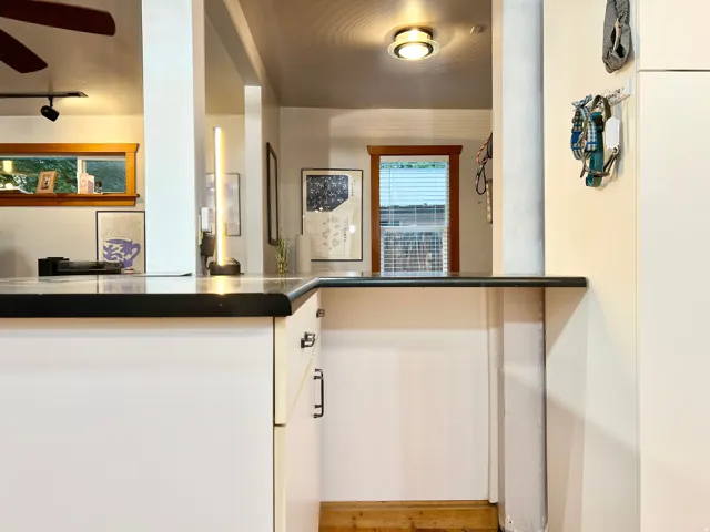 Black countertops with a built-in breakfast bar