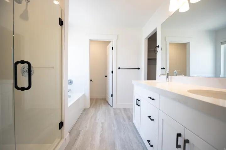 Primary bath with double vanity and separate tub and shower
