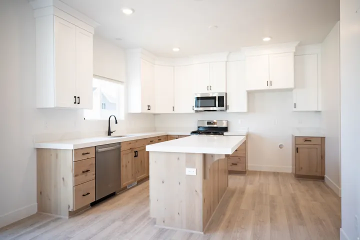 Upgraded kitchen with large island and quartz countertops