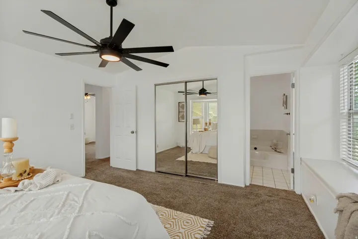 Primary bedroom with easy access to jack and jill like hallway bath