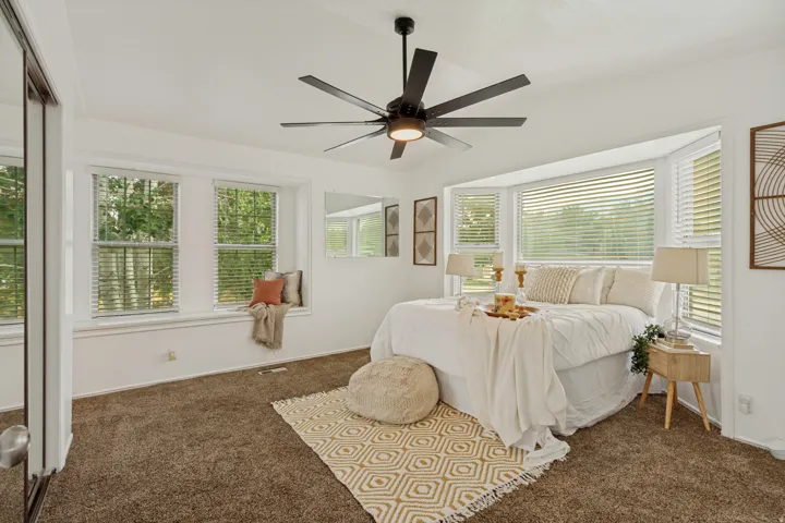 Spacious Primary bedroom with bay window and ample natural light - upper level