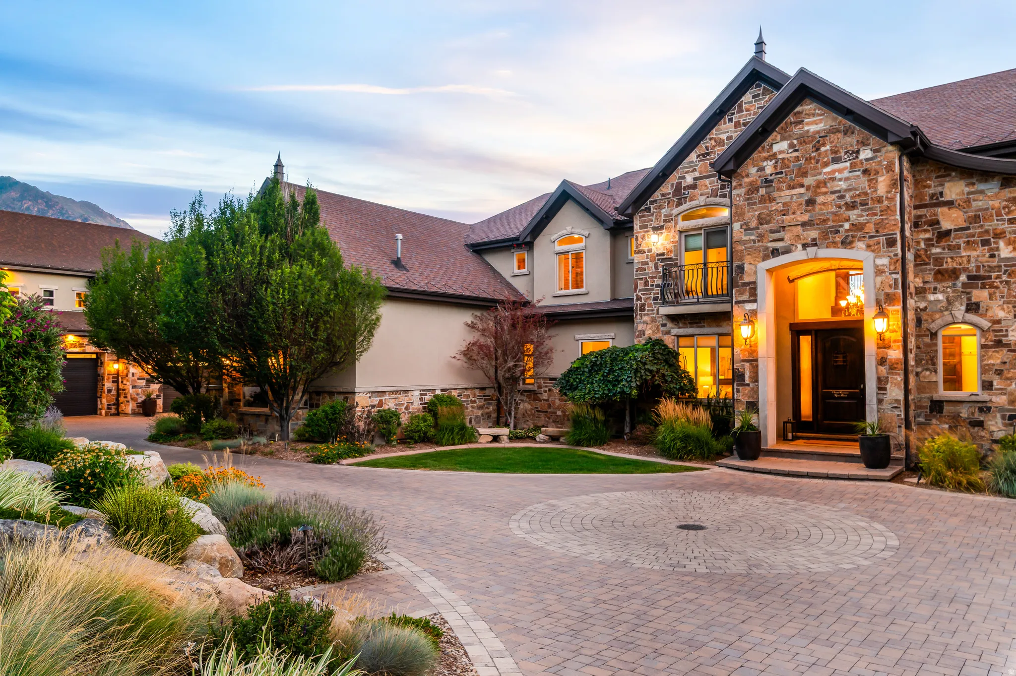Stone exterior facade with a prominent arched entry