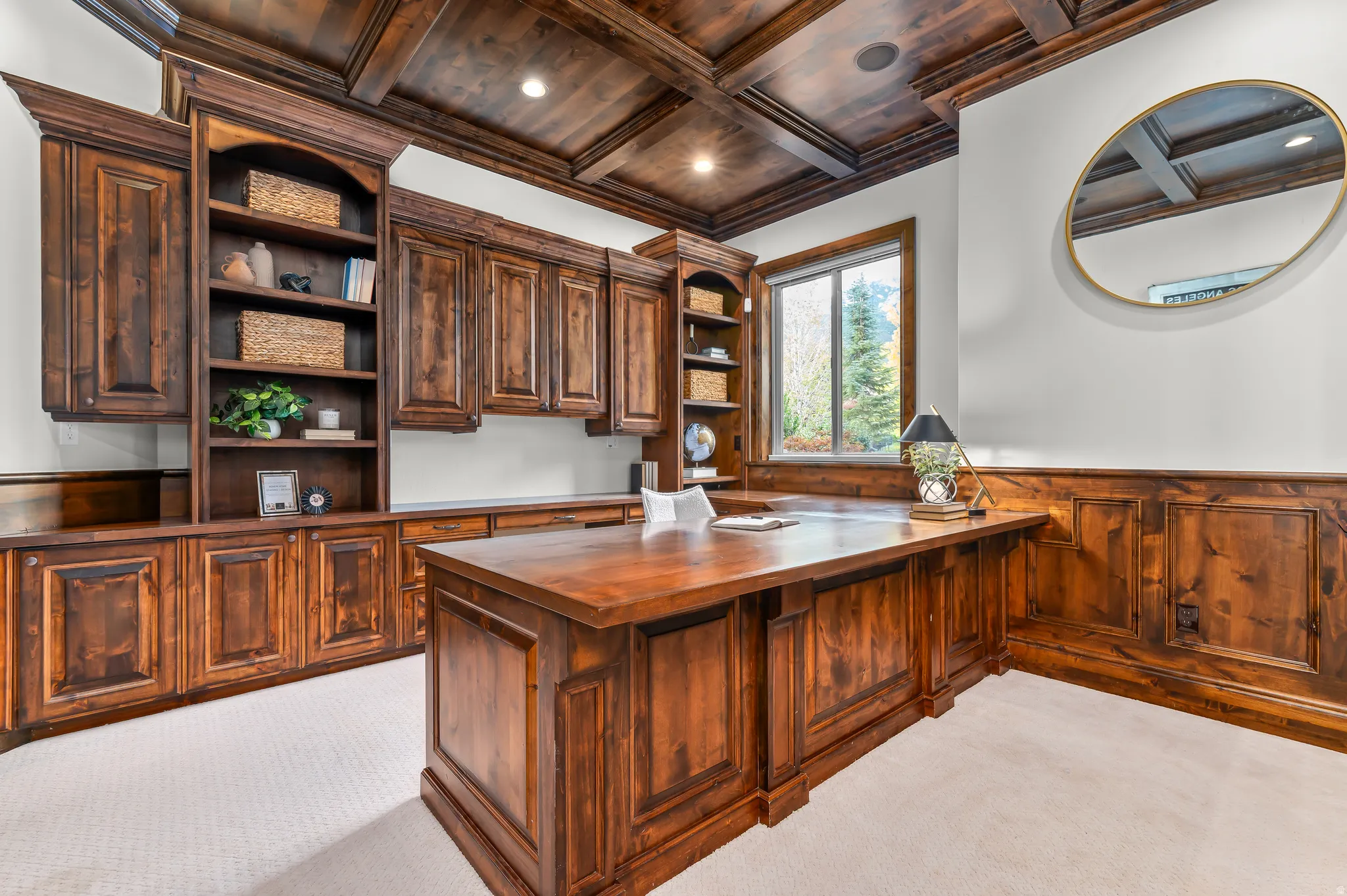 Custom wood-finish coffered ceiling, built-in cabinetry, and wood-paneled walls