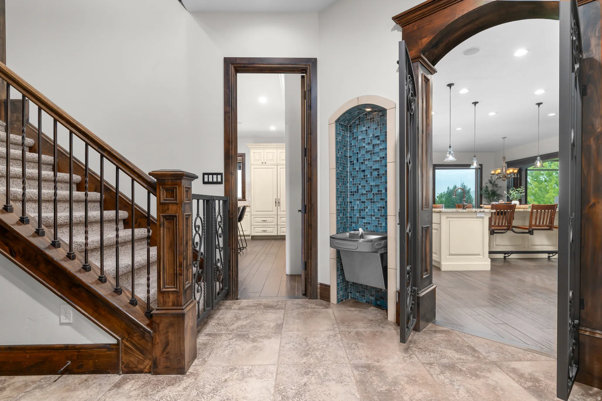 Wood staircase with wrought iron balusters