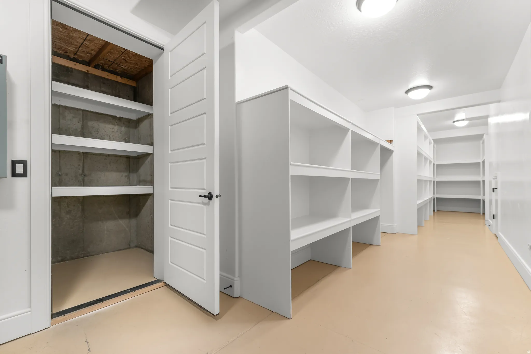 Built-in storage solutions, recessed lighting, and a neutral flooring finish