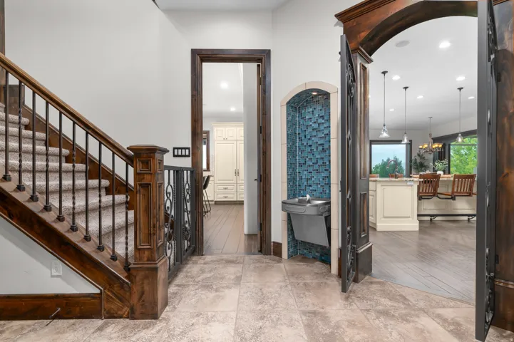 Wood staircase with wrought iron balusters
