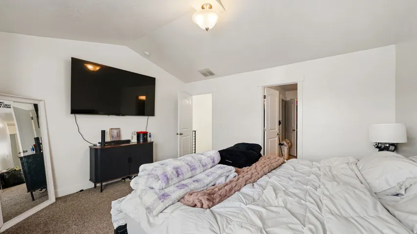 2nd Floor Master - White walls with an angled ceiling, recessed lighting, and carpeted flooring