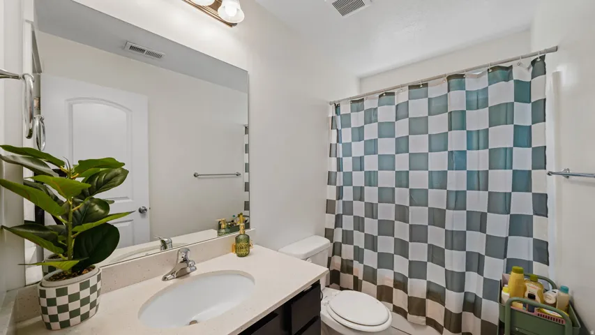 2nd Floor Guest Bathroom - Vanity with an integrated sink and light-colored countertop