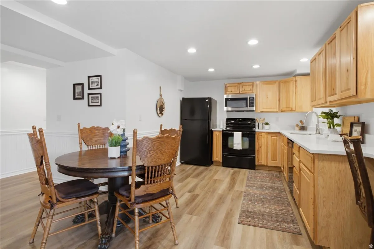 Lower-level kitchen and dining space adds exceptional flexibility to the finished basement.