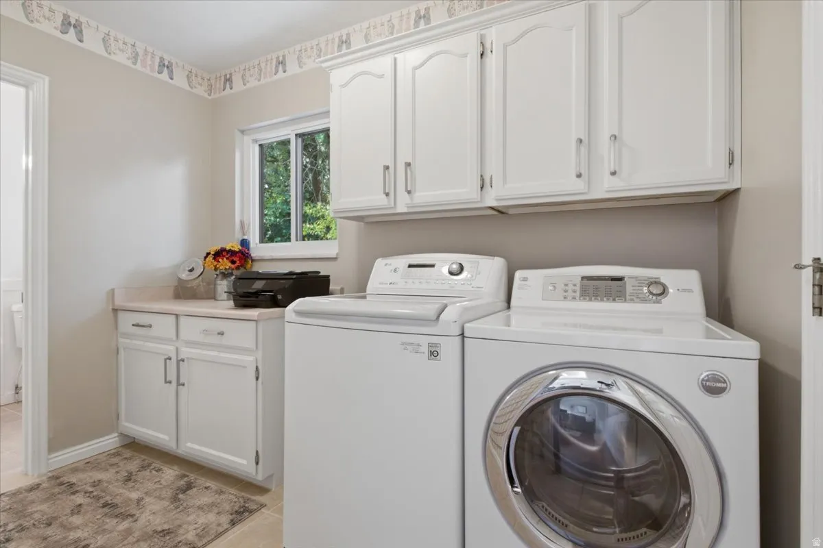 Convenient main-level laundry provides cabinetry, counter space and natural light.