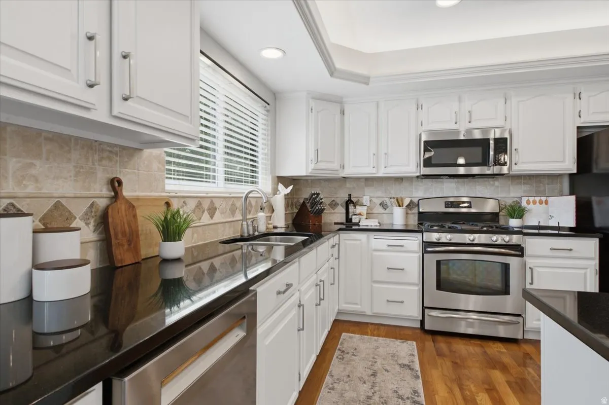 Bright kitchen features generous counter space, stainless appliances and convenient workspace.