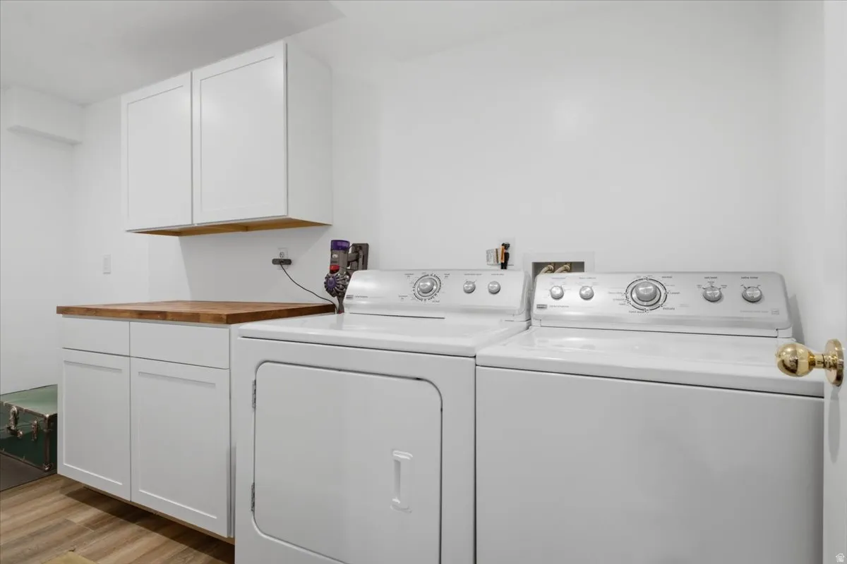 Separate lower-level laundry adds convenience and supports the basement's flexible living possibilities.