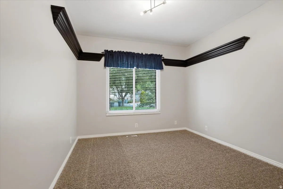 Third main level bedroom provides additional flexibility within the finished basement