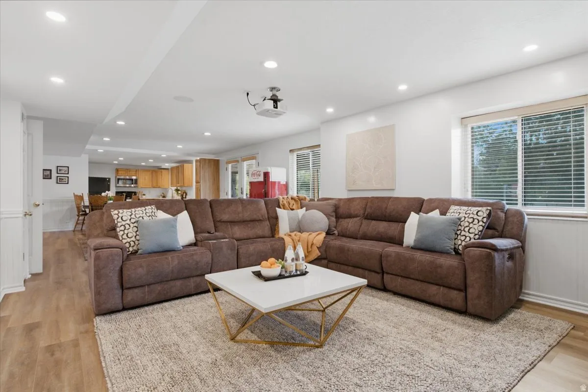 Recreation area includes space for a pool table and connects directly to the second kitchen and outdoor access.