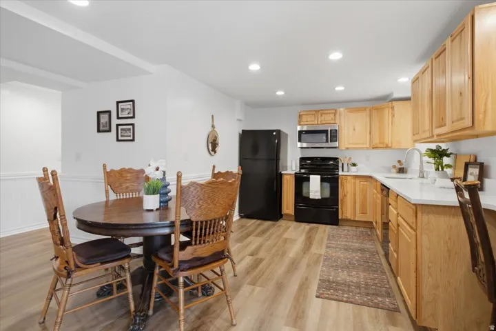 Lower-level kitchen and dining space adds exceptional flexibility to the finished basement.