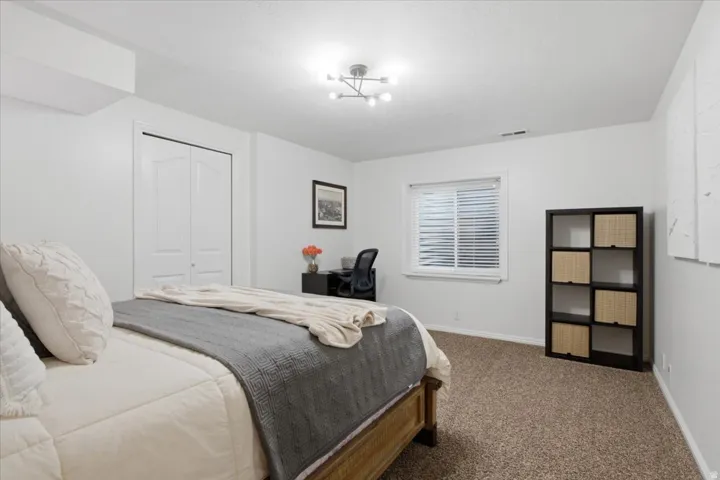 Third lower-level bedroom provides additional flexibility within the finished basement