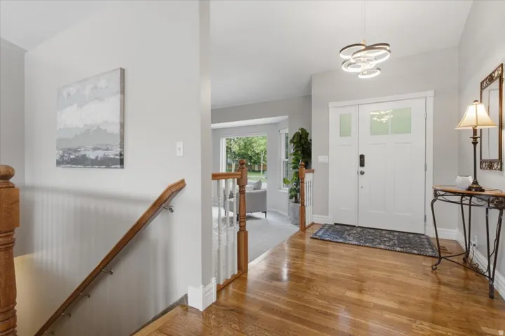 Welcoming entry introduces the home's bright interior, hardwood flooring and vaulted ceilings