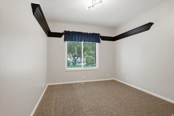 Third main level bedroom provides additional flexibility within the finished basement