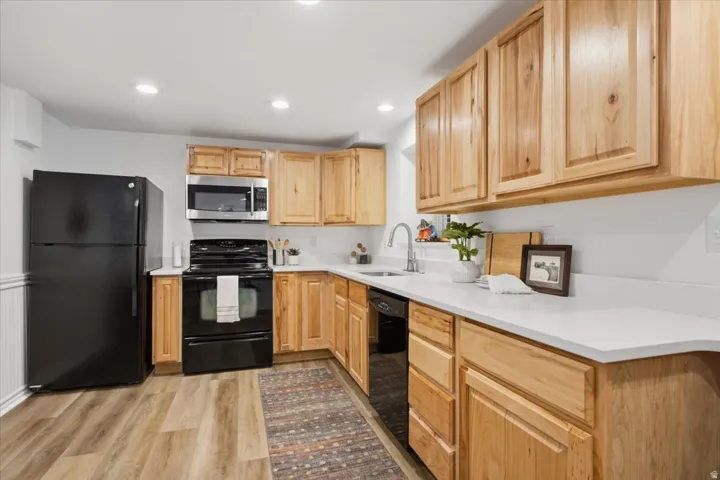 Second kitchen features quartz countertops, abundant cabinetry and generous prep space