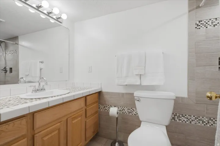 Lower-level full bath provides convenient accommodations for the basement living space.