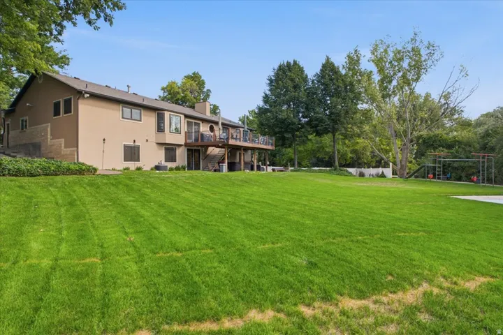 Expansive lawn, mature trees and multiple outdoor living areas make the backyard a standout feature.