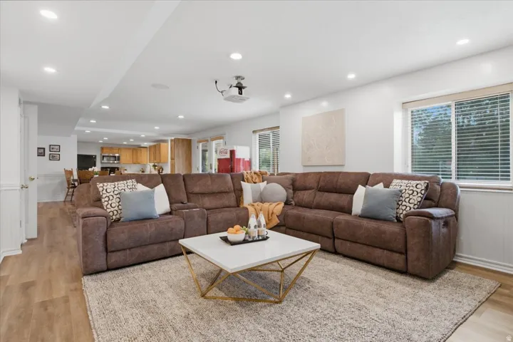 Recreation area includes space for a pool table and connects directly to the second kitchen and outdoor access.