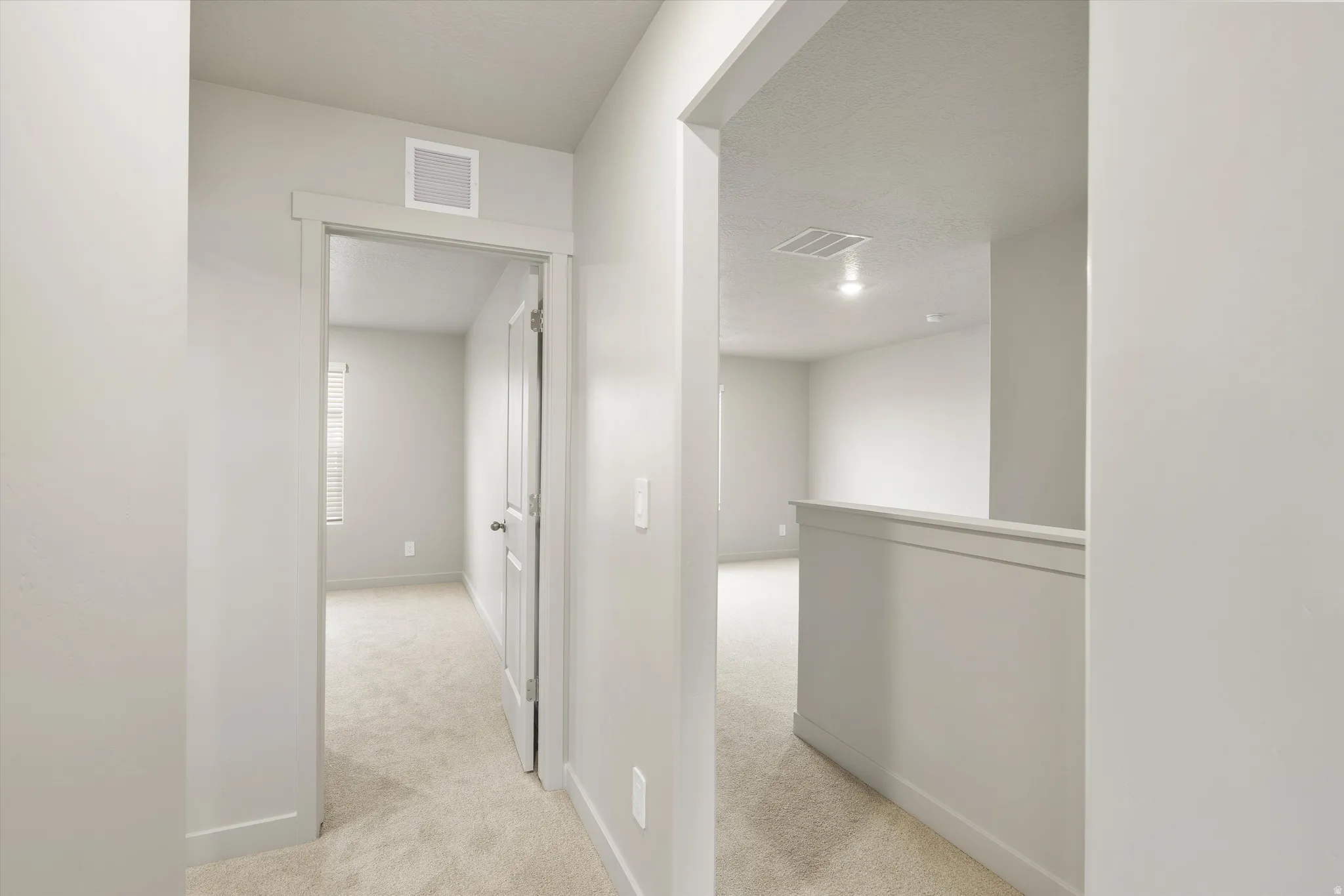 **DISCLAIMER** This floorplan has upgrades not photographed.Neutral-toned walls complement carpeted flooring and white trim throughout