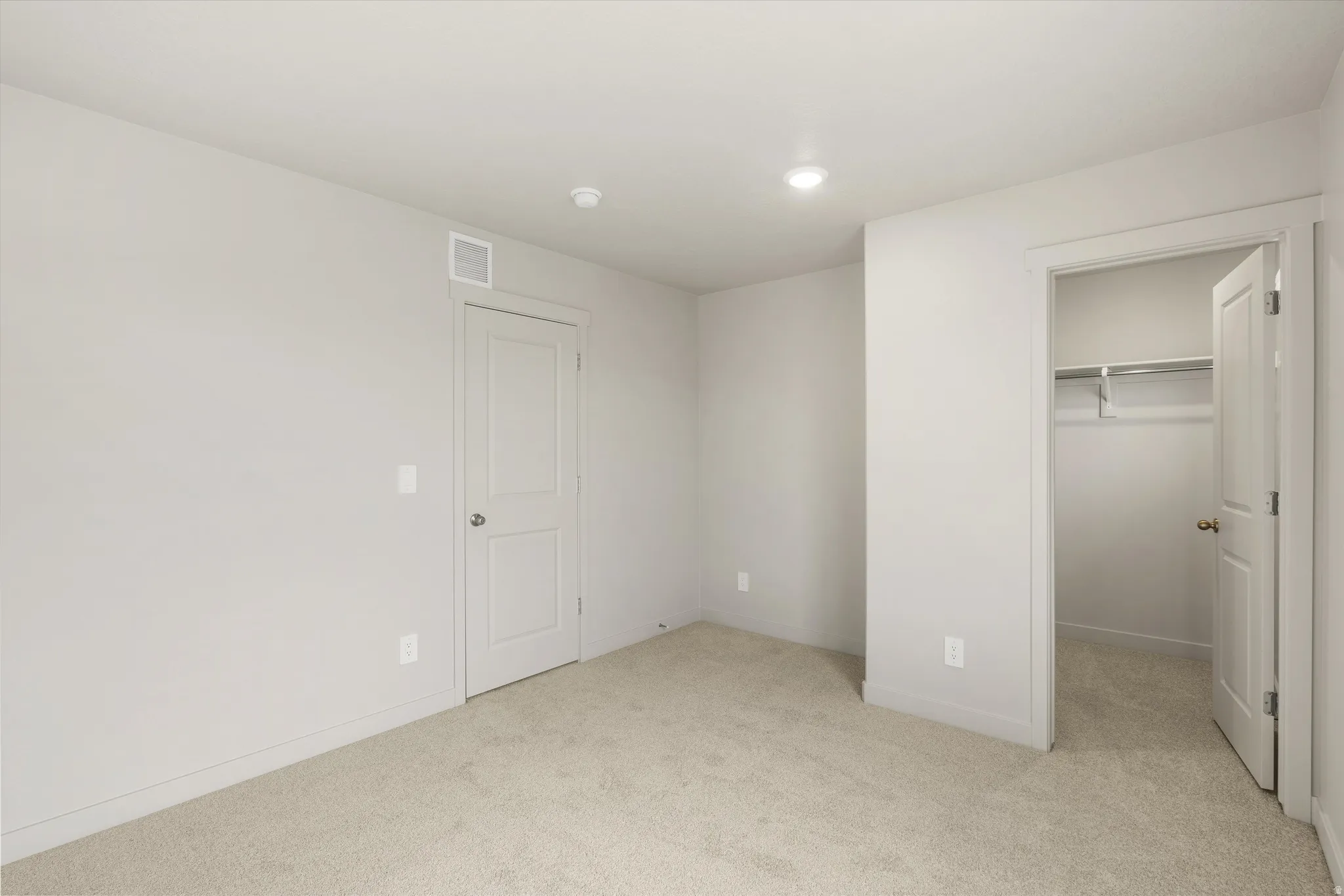 **DISCLAIMER** This floorplan has upgrades not photographed.Plush carpet flooring, recessed ceiling lighting, light-colored walls, and a built-in closet with shelving