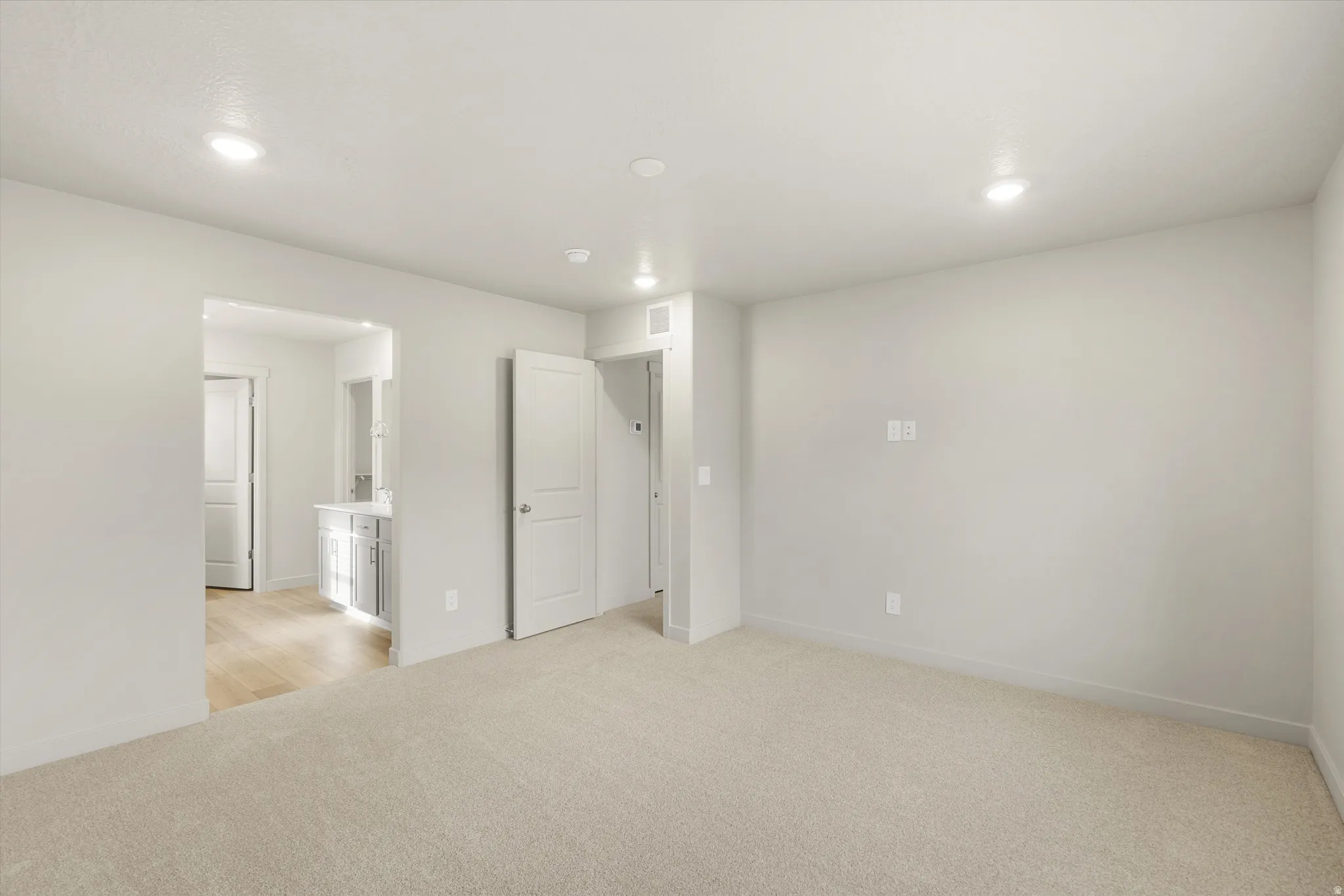 **DISCLAIMER** This floorplan has upgrades not photographed.Soft carpet flooring, recessed lighting, white interior doors, and a neutral wall palette