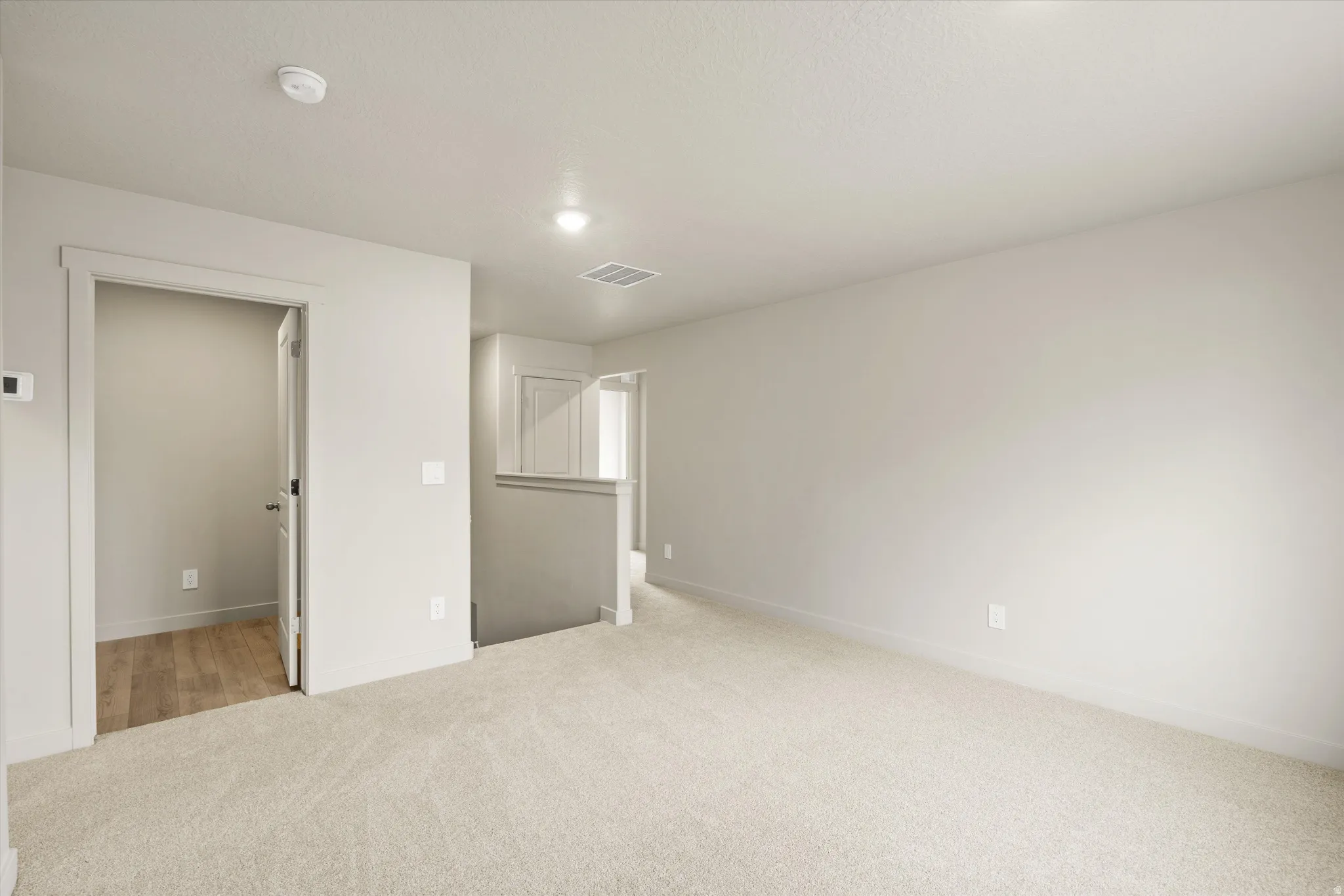**DISCLAIMER** This floorplan has upgrades not photographed.Neutral-toned carpeting, recessed ceiling lighting, and a white interior door