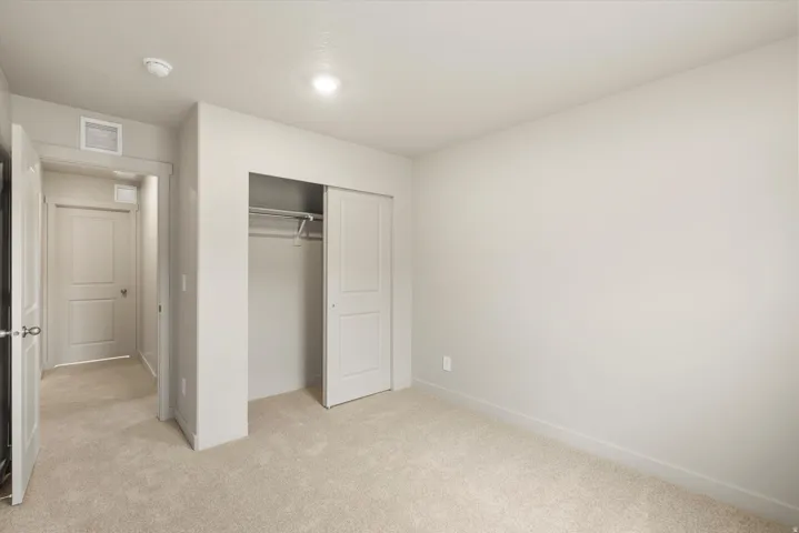 **DISCLAIMER** This floorplan has upgrades not photographed.Plush carpeting, recessed ceiling lighting, sliding closet doors, and neutral wall tones