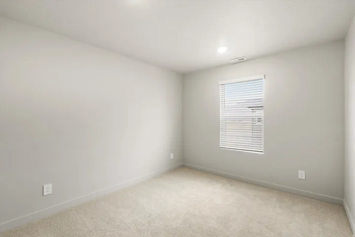 **DISCLAIMER** This floorplan has upgrades not photographed.Neutral wall paint, recessed lighting, window with blinds, and light-toned carpet