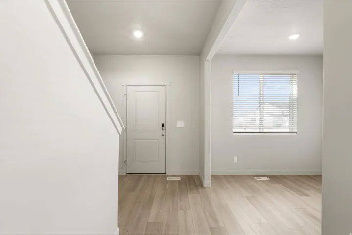 **DISCLAIMER** This floorplan has upgrades not photographed.This home is part of our new Light wood-finish flooring, recessed lighting, and a window with horizontal blinds