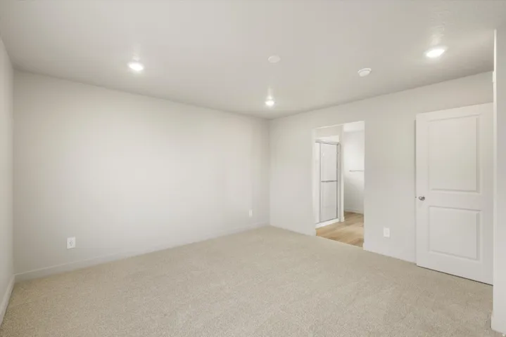 **DISCLAIMER** This floorplan has upgrades not photographed.Neutral-toned walls, recessed lighting, and soft carpeting complement the interior