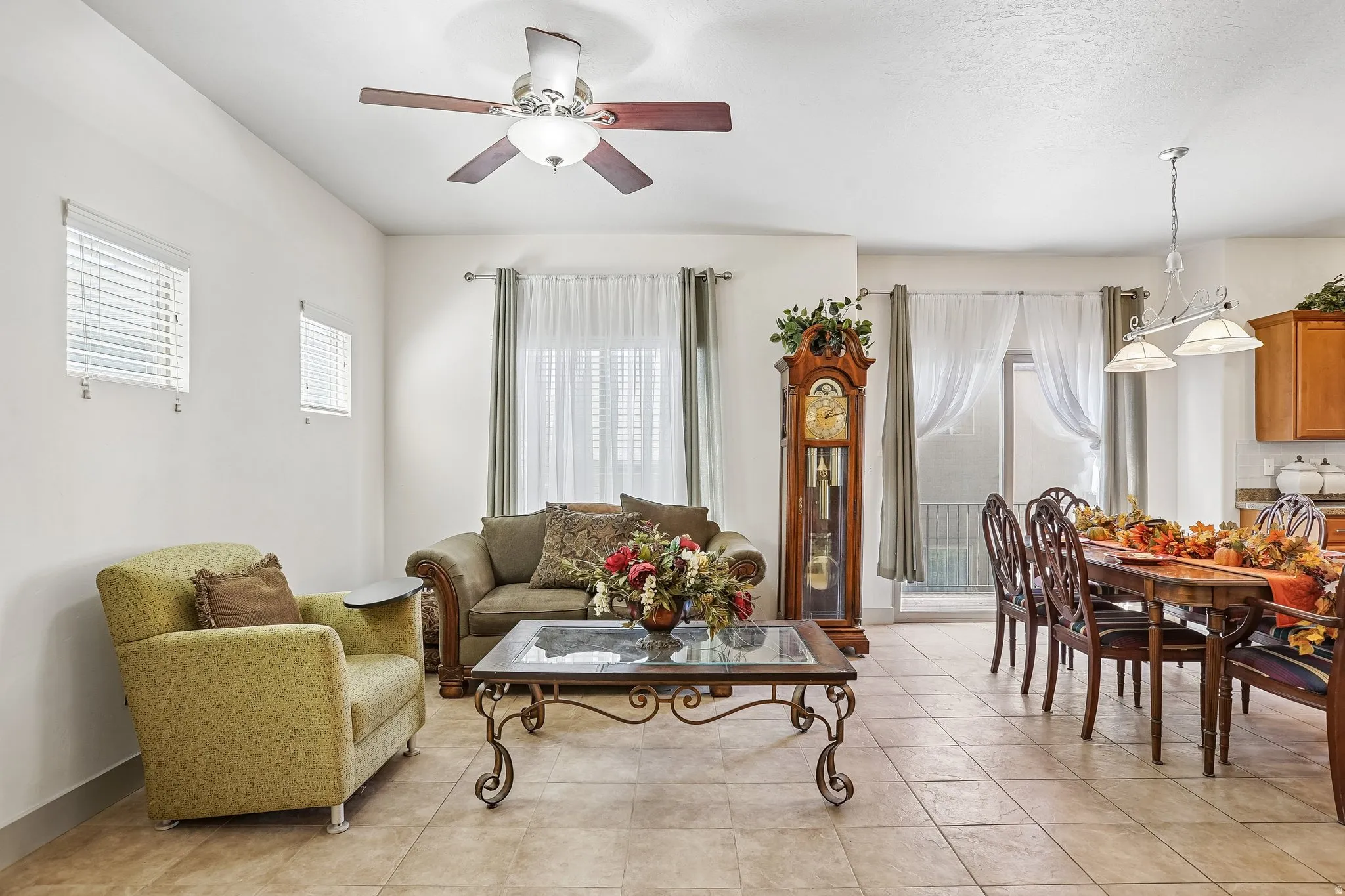 Tile flooring, ceiling fan with light fixture, window blinds, and recessed lighting