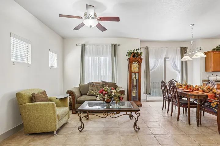 Tile flooring, ceiling fan with light fixture, window blinds, and recessed lighting